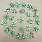 Green rhinestone flower patches detail shot