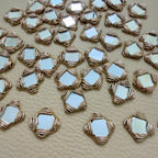 Antique gold square mirror applique patches – close-up view