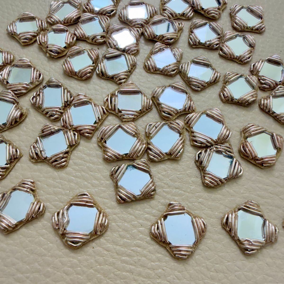 Antique gold square mirror applique patches – close-up view