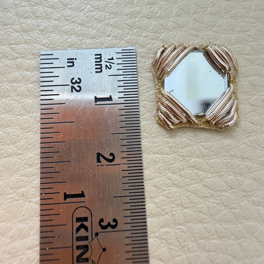 Antique gold square mirror applique patch beside ruler showing approximately 4 cm size