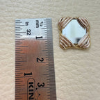 Antique gold square mirror applique patch beside ruler showing approximately 4 cm size