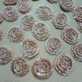 Front and mesh backing of rose gold metallic coil and iridescent sequin floral patches