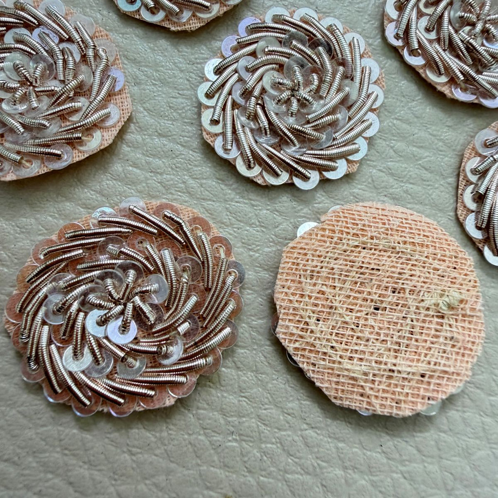 Rose gold sequin floral patch beside ruler measuring approximately 2.5 cm across