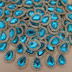 Front and fabric backing of aqua blue teardrop crystal rhinestone patch