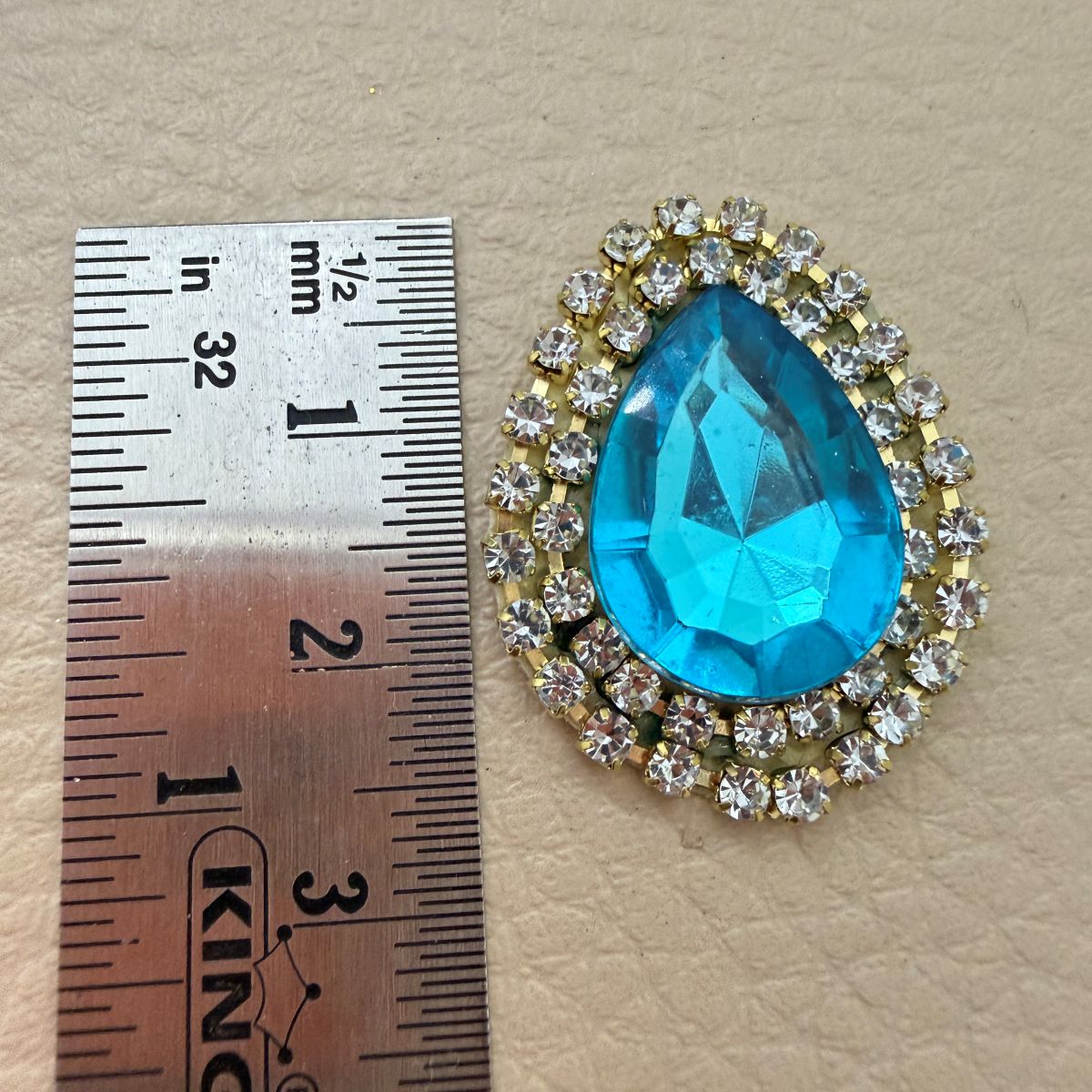Aqua blue teardrop rhinestone patches arranged in rows