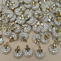 White crescent patch with layered pearl-like beads, clear rhinestones, center crystal, and gold marquise accents
