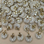 White crescent patch with layered pearl-like beads, clear rhinestones, center crystal, and gold marquise accents