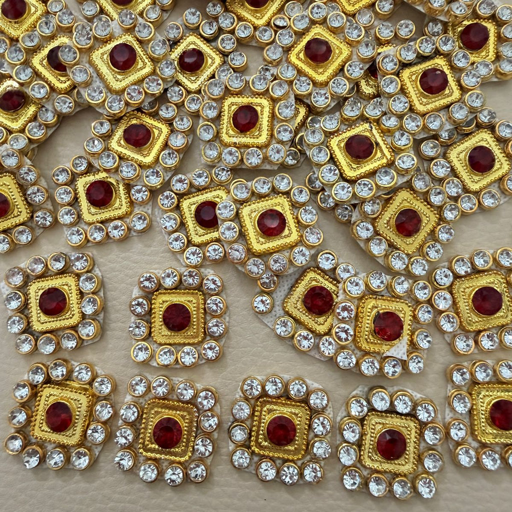 Front and back view of ruby red square patch with clear rhinestones and gold-tone frame