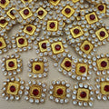 Front and back view of ruby red square patch with clear rhinestones and gold-tone frame