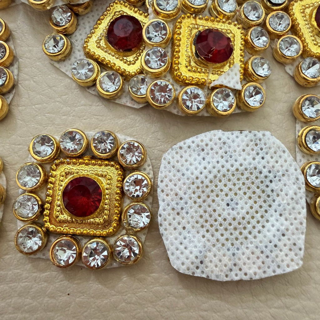 Ruby red and clear rhinestone square patch shown beside ruler measuring approximately 2.8 cm