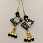 Black and gold embroidered tassels with shimmering sequin details and soft black ends