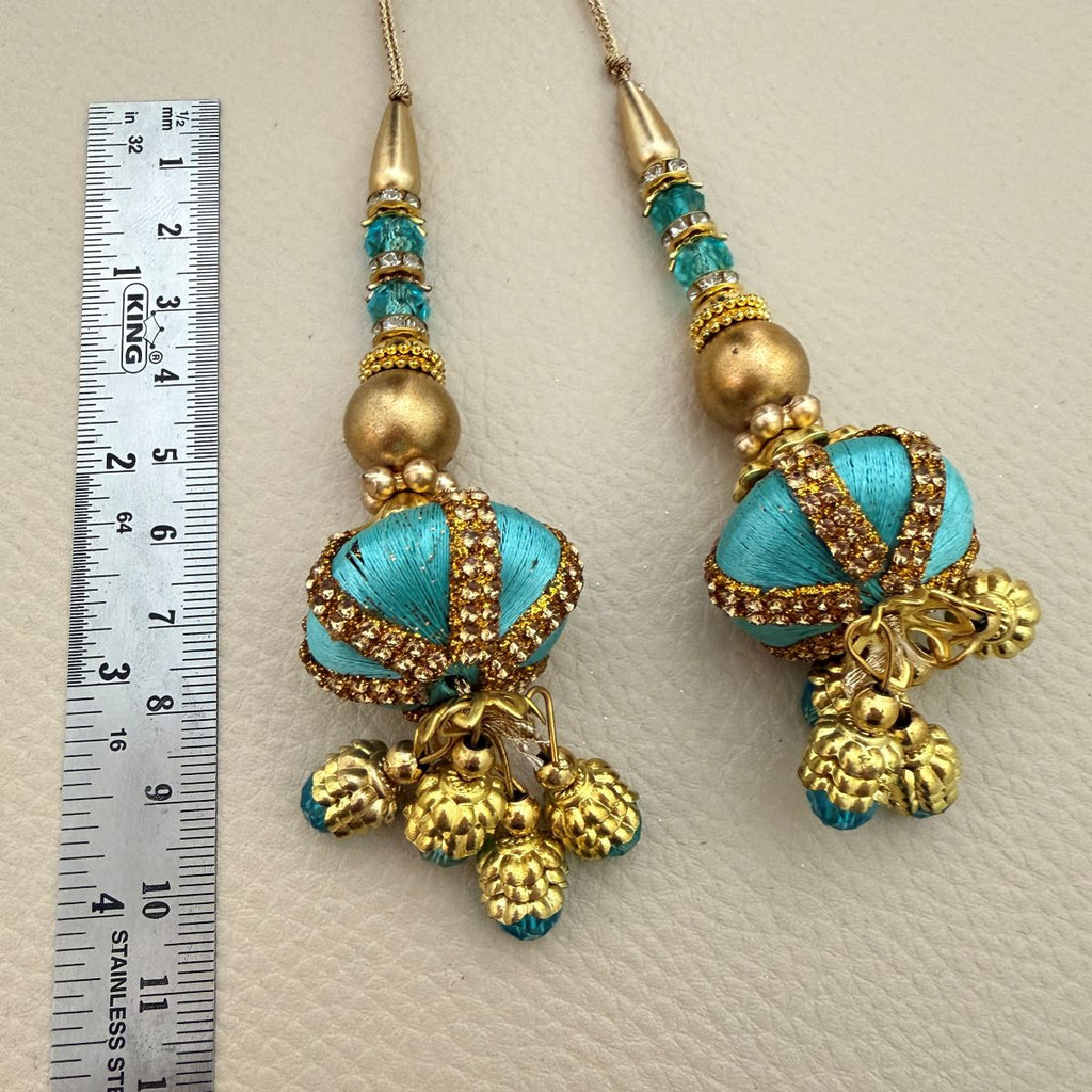 Multiple turquoise, teal and antique gold decorative latkan tassels