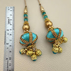 Multiple turquoise, teal and antique gold decorative latkan tassels