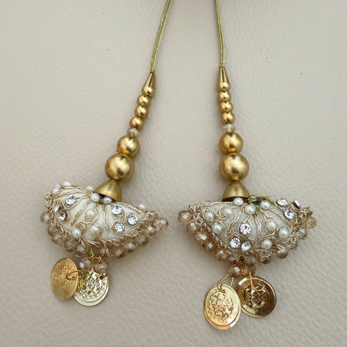 Ivory and gold embroidered bell latkan tassels with pearl beads, rhinestones and coin charms