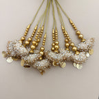 Group of ivory and gold embroidered bell latkan tassels with beaded cords