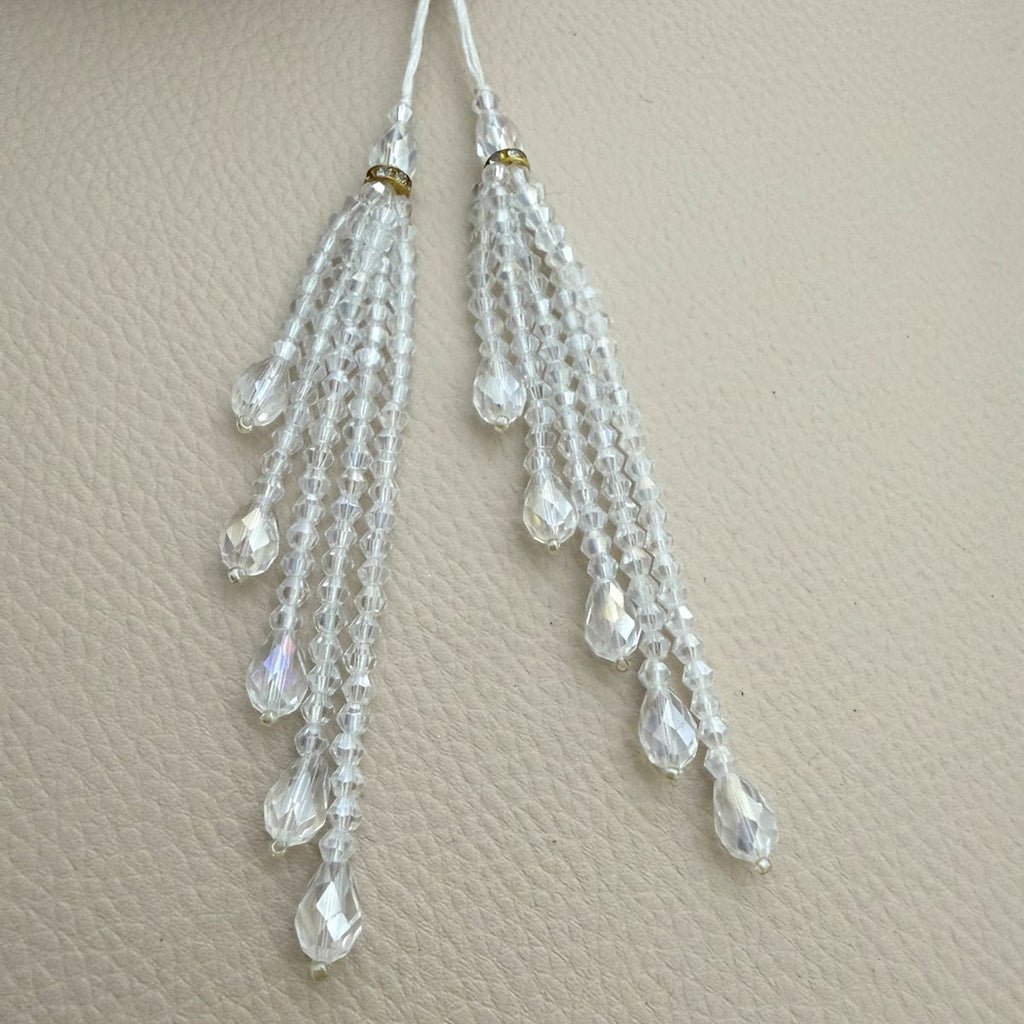 Bunch of crystal clear beaded teardrop tassels with gold rhinestone rings