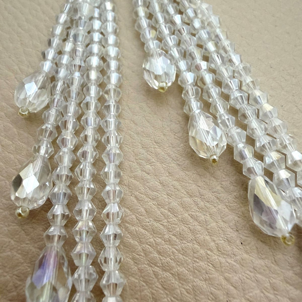 Crystal beaded tassel measured against a ruler showing about 4.5 inches
