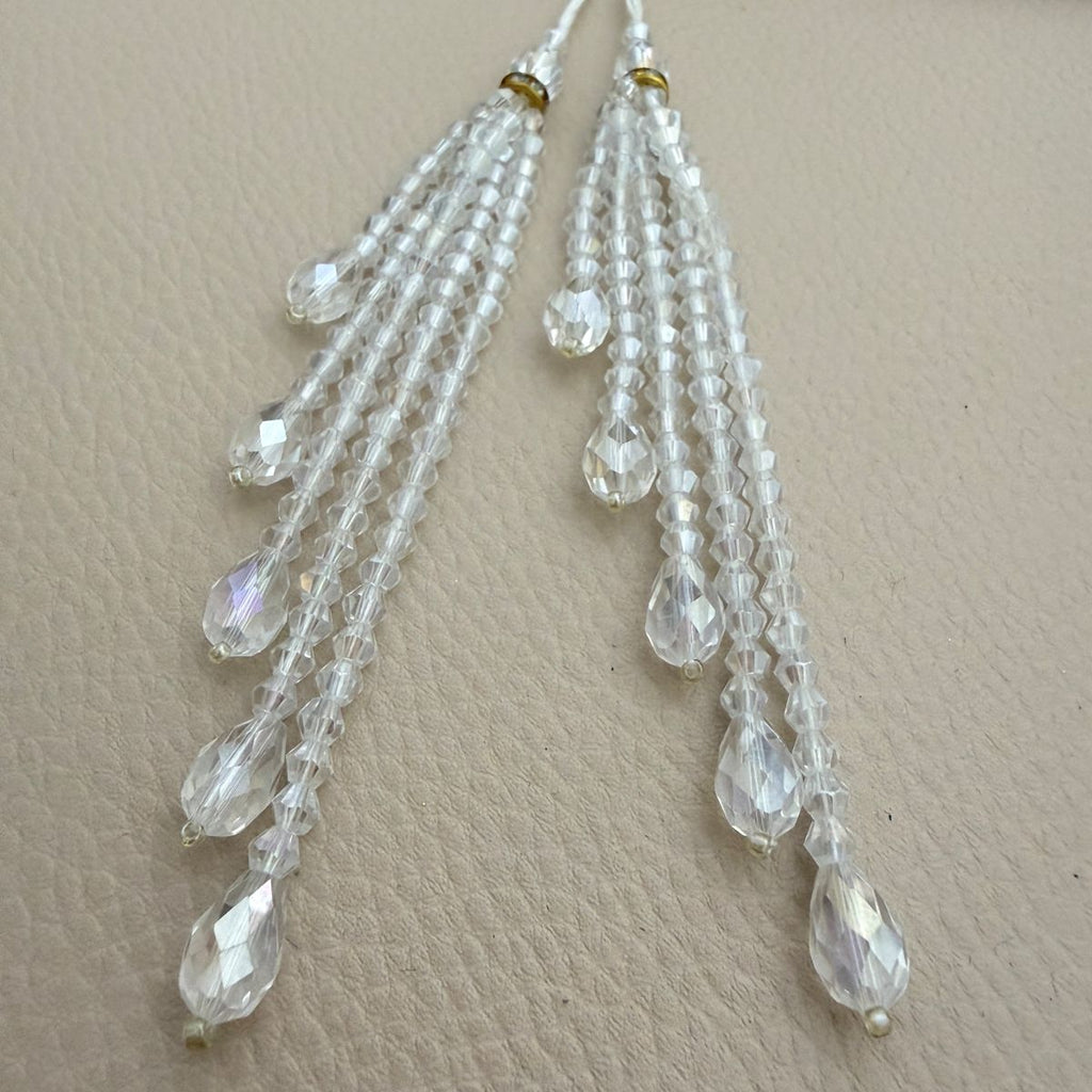 Two crystal teardrop beaded tassels on a cord loop