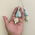 Group of pastel thread latkan tassels with white seed-bead ball drops