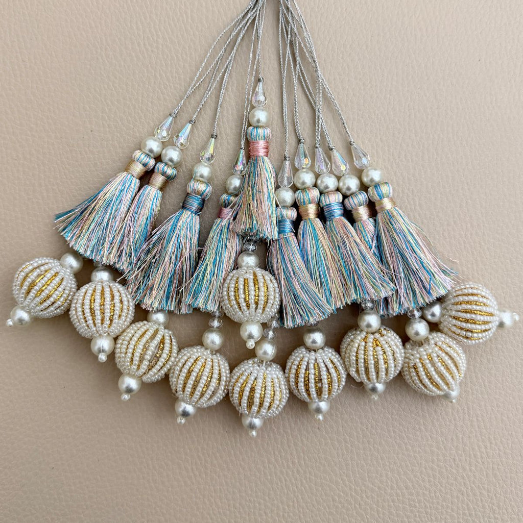 Pastel multicolor thread latkan tassel held in hand to show size and detailing
