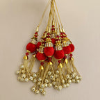 Group of matching red and gold beaded chain latkan tassels for decorative use