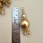 Group of gold pearl-look and champagne crystal-style bead tassel latkans