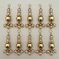 Single gold tone latkan showing clear beads, rhinestone spacer, and brushed gold center bead