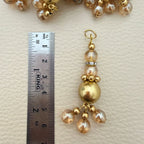 Multiple gold tone beaded latkans arranged together