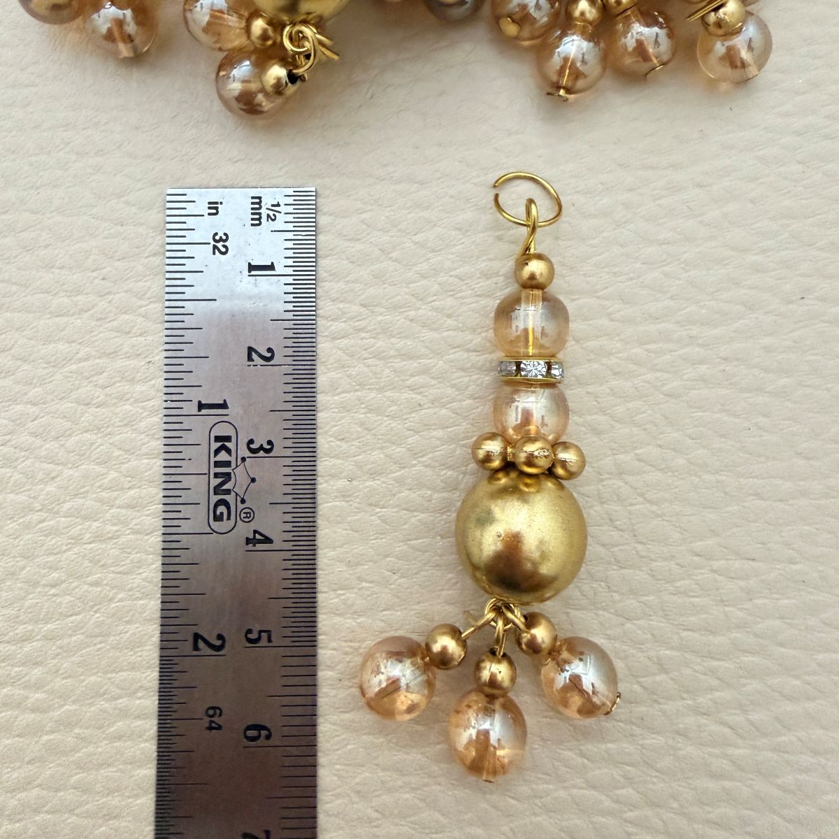 Multiple gold tone beaded latkans arranged together