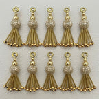 Ten gold metallic beaded tassel charms arranged in two rows