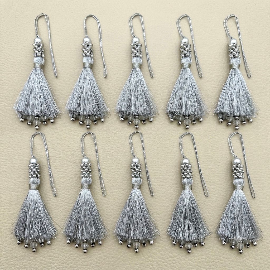 Single silver silk tassel with hanging cord loop