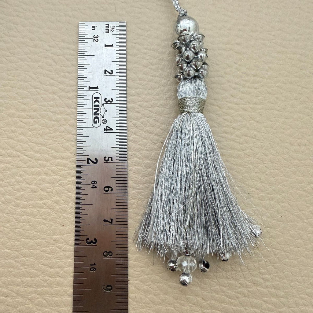 Close-up of silver tassel crystal and bead fringe tips