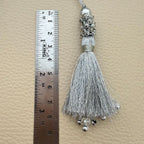 Close-up of silver tassel crystal and bead fringe tips