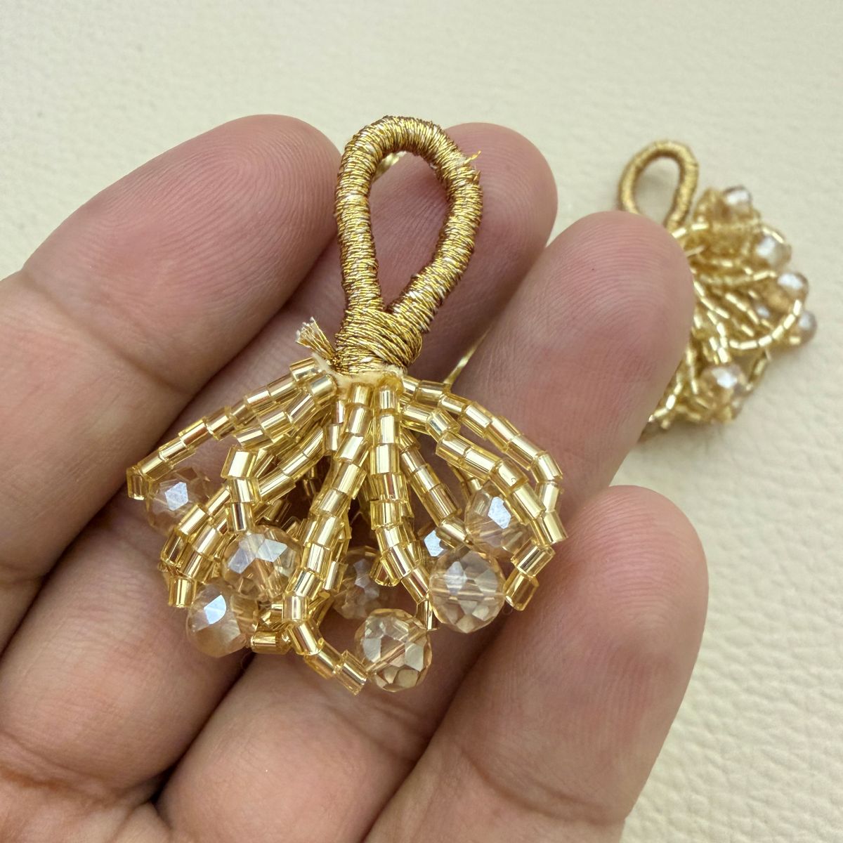 Single gold crystal bead bunch latkan with fan-shaped beaded cluster