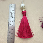 Bulk assortment of fuchsia pink tassels with pearl-style beads