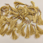 Single gold thread tassel with pearl-look beads, metallic spacers, and gold-tone cap