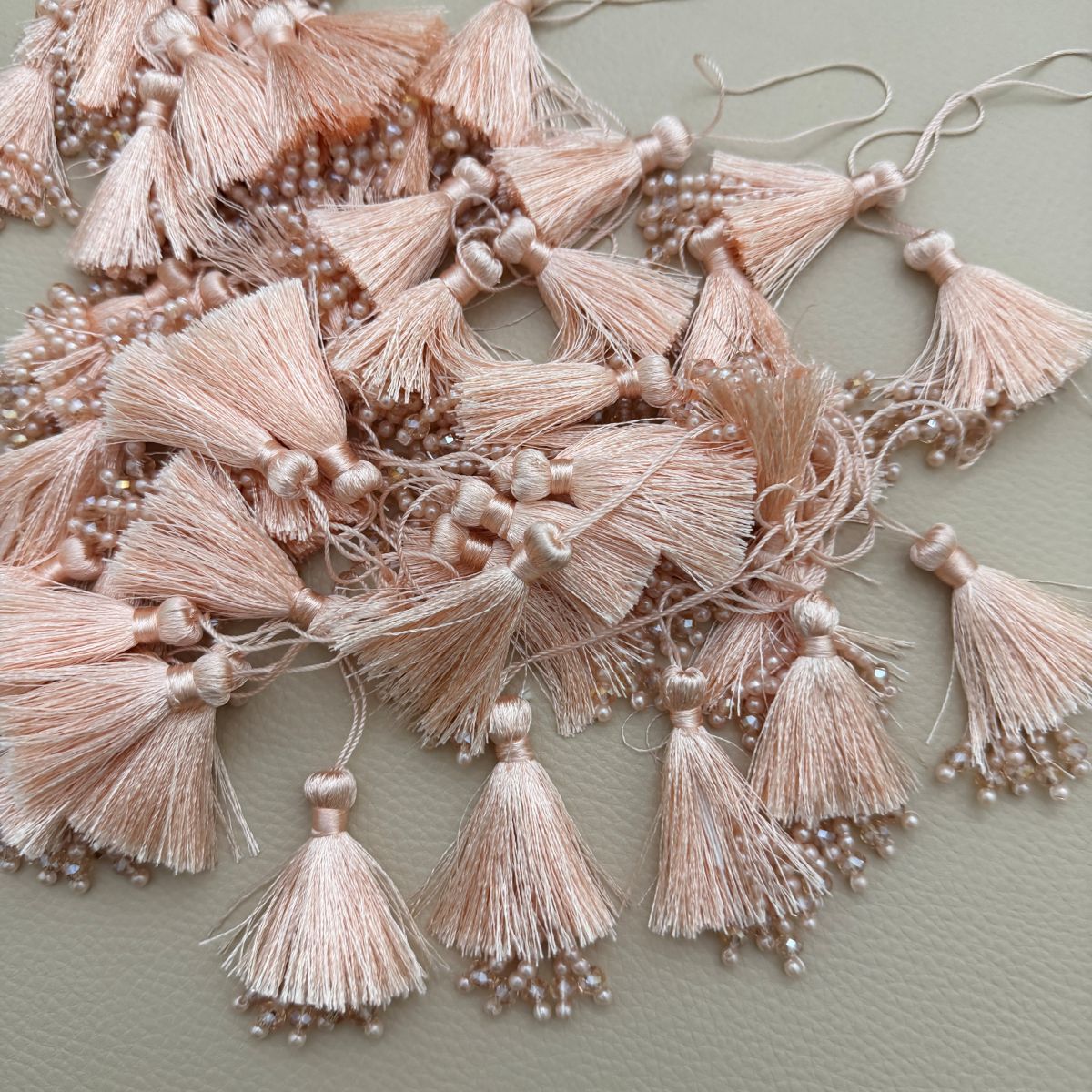Set of teal green silk tassel latkans with beaded fringe
