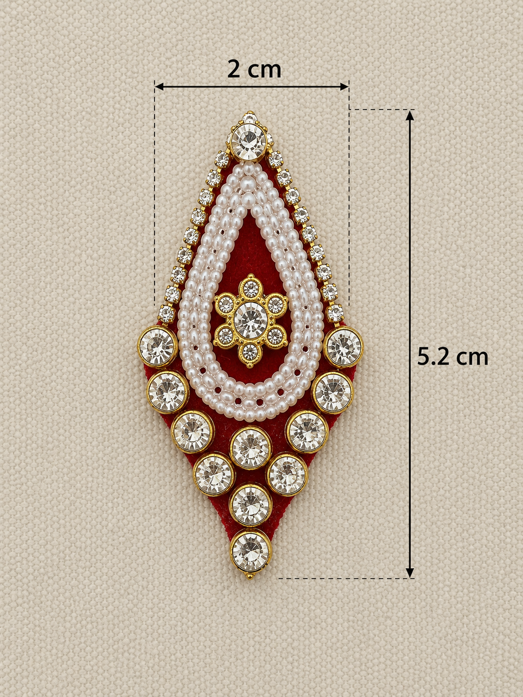 Decorative brooch with measurements on a beige background