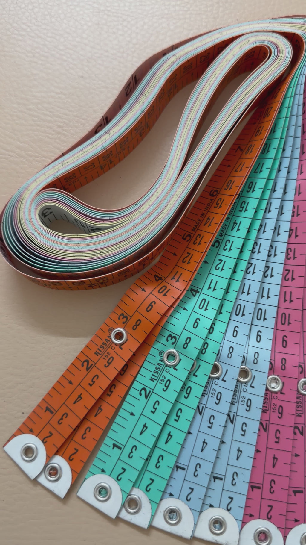 Yellow measuring tape with black text on a white background