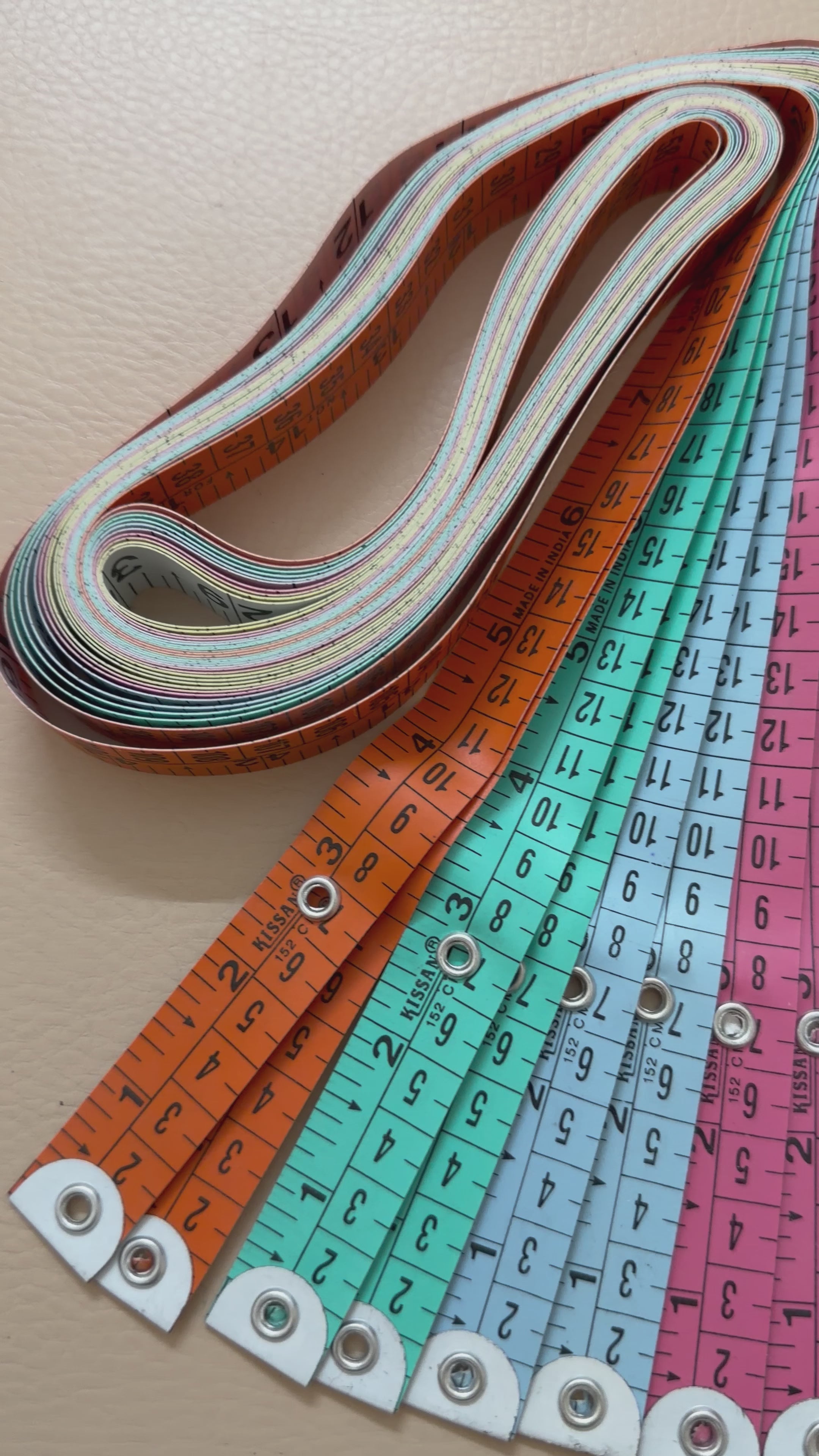 Yellow measuring tape with black text on a white background