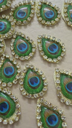 Decorative peacock feather patterns  blue centers on a beige background