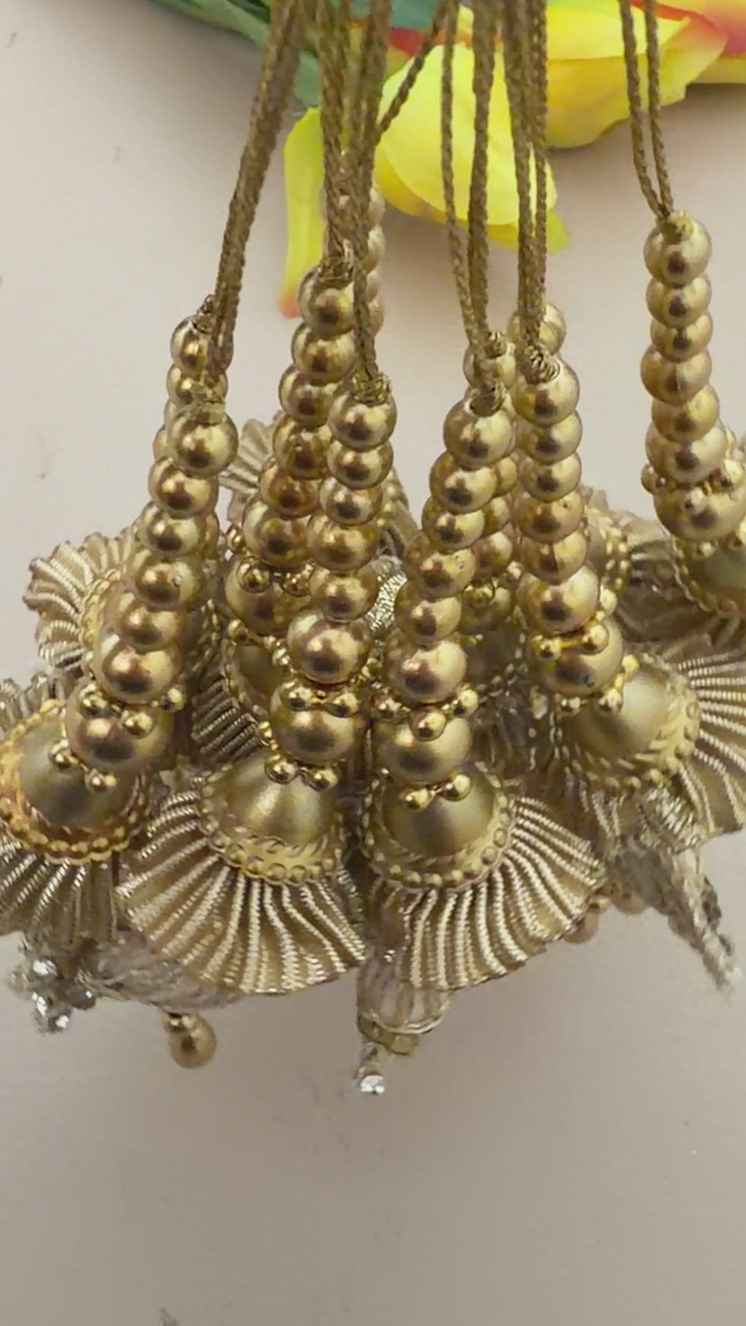 Pair of gold and silver earrings on a light background