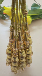 gold tassels with pearl