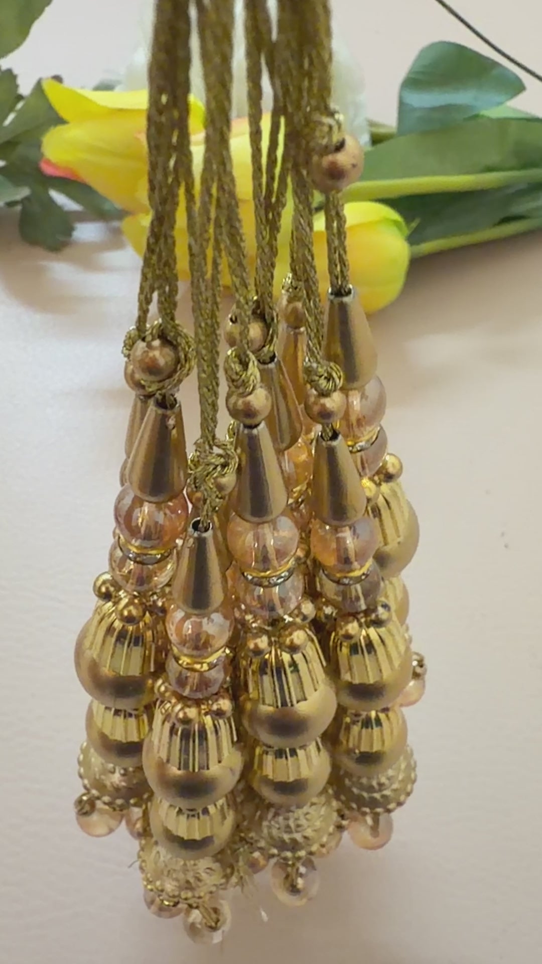 gold tassels with pearl
