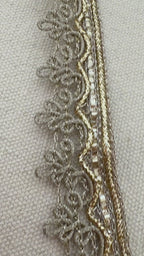 Decorative ribbon roll with intricate patterns on a light background