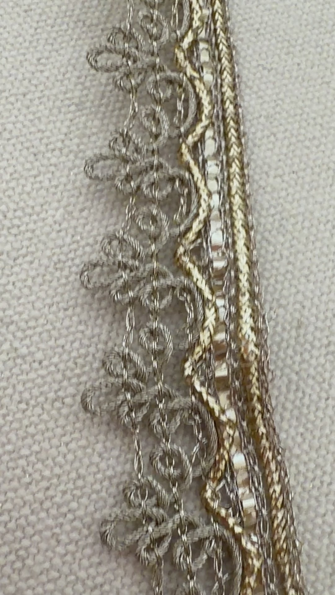 Decorative ribbon roll with intricate patterns on a light background